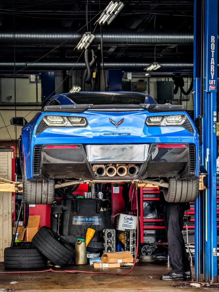 Car raised on a ramp in the workshop