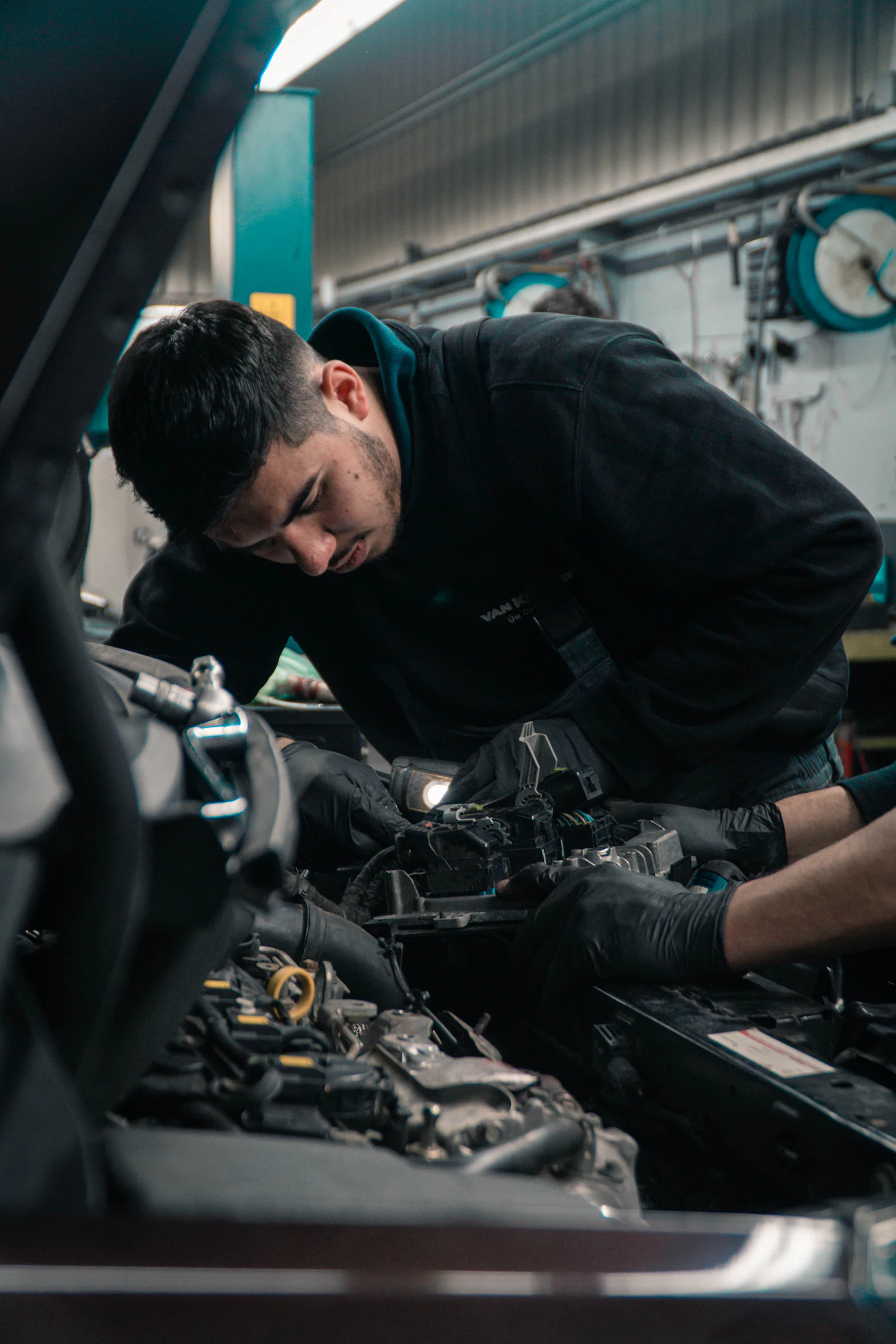 Mechanic working on a car engine