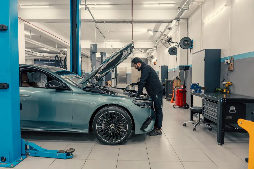 Mechanic working on a car in the workshop